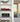 Modern shelf displaying detailed red Formula 1 model and blue vintage convertible model cars in clear cases