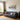 Modern living room with gray sofa, colorful cushions, indoor plants, and vibrant pop art wall painting