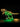 Illuminated LEGO T-Rex skeleton model with yellow and green LED lights on black background