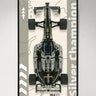 Top view of a silver and black LEGO Formula 1 model car with large tires on a beige and grey background poster labeled Silver Champion