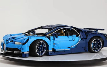 Blue LEGO Bugatti Chiron model car displayed on a rotating platform with open doors