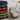 LEGO Technic display cases showcasing a collection of supercars