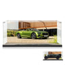 Green Bentley convertible model car displayed in clear acrylic display case with scenic background