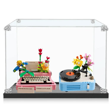 LEGO display of pink typewriter and blue record player with colorful flowers in clear acrylic case