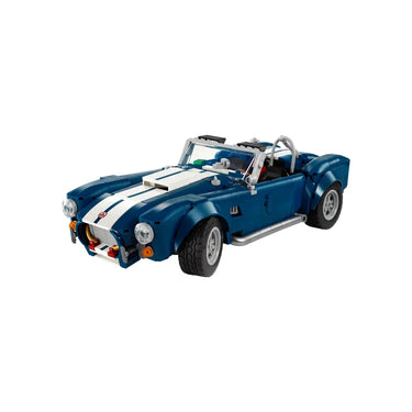 Blue and white LEGO model of a classic Shelby Cobra sports car with detailed headlights and racing stripes