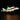 LEGO NASA space shuttle Enterprise attached to white carrier aircraft with illuminated lights on black background