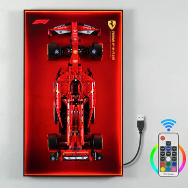 Top view of Ferrari SF-24 F1 car model mounted on illuminated red display with USB and wireless remote