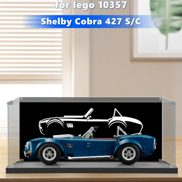 LEGO Shelby Cobra 427 S/C model displayed in a clear acrylic case on a wooden table