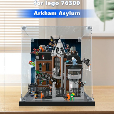 LEGO Arkham Asylum set 76300 displayed in clear protective case on wooden surface with minifigures