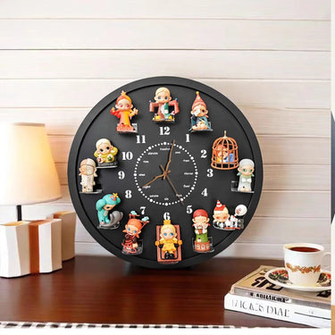 Black wall clock with unique colorful cartoon character figurines at each hour, on a wooden table