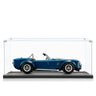 Blue classic convertible sports car model displayed inside clear glass showcase