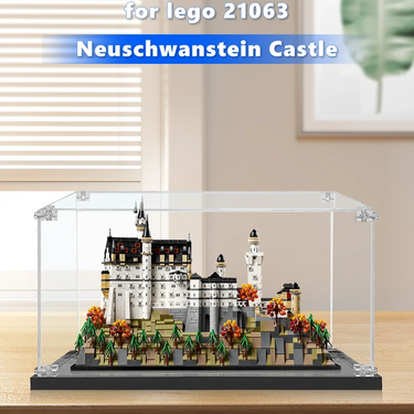 LEGO model of Neuschwanstein Castle displayed in clear protective case on wooden table