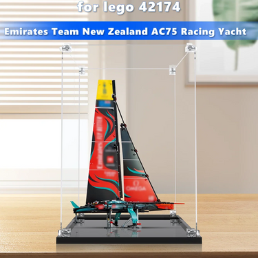 Lego 42174 Emirates Team New Zealand AC75 Racing Yacht model in clear display case on wooden table
