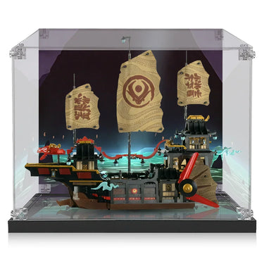 Miniature model of a fantasy pirate ship with beige sails and red propeller inside a clear display case