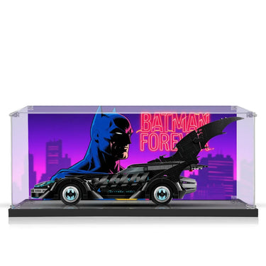 Lego Batman Forever Batmobile model in acrylic display case with neon cityscape backdrop