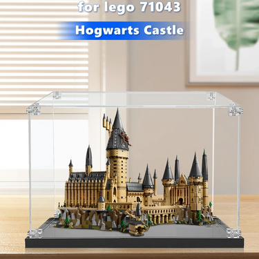 Lego Hogwarts Castle model 71043 displayed in clear protective case on wooden table