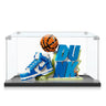 LEGO set of blue and white Nike Dunk sneaker with basketball and DUNK text in clear display case