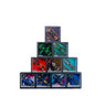 Stack of boxed Formula 1 model cars with colorful racing designs and mini driver figures