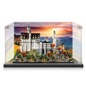 Detailed LEGO model of Neuschwanstein Castle in clear display case with autumn forest backdrop