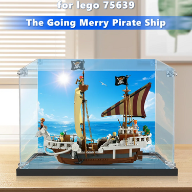 Lego model of The Going Merry Pirate Ship (set 75639) displayed in clear case on wooden table