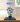 LEGO hibiscus flower model 10372 in blue pot displayed inside glass case on wooden surface