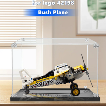 Lego bush plane model 42198 displayed in clear acrylic case on wooden table
