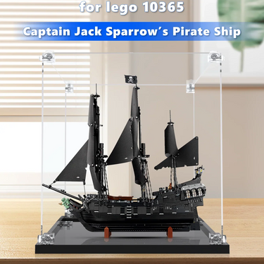 Black Captain Jack Sparrow’s Pirate Ship LEGO 10365 model displayed in clear acrylic case on wooden table