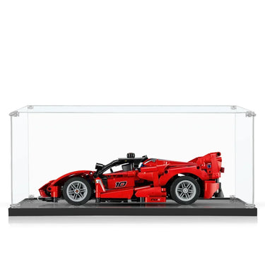 Red race car model displayed in clear acrylic showcase with black base, detailed LEGO build
