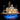 Illuminated detailed LEGO riverboat model on blue-lit stand with smokestacks and paddlewheel