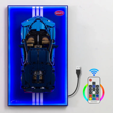 Top view of blue Bugatti Chiron LEGO model mounted on LED-lit display board with USB power and wireless remote