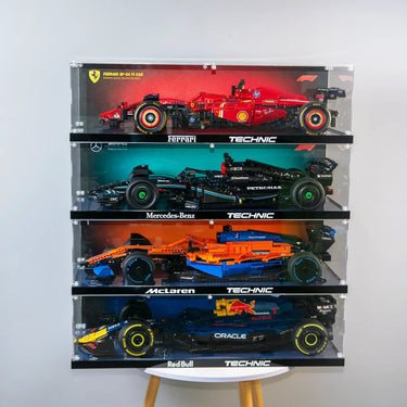 Stacked display cases with LEGO Technic Formula 1 cars: Ferrari SF-24, Mercedes-Benz, McLaren, and Red Bull