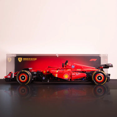 Red Ferrari SF-90 F1 model car with Shell and HP logos on black reflective surface and red background