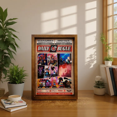Framed Daily Bugle LEGO minifigures display on wooden desk with plants and books