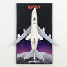 Top view of NASA space shuttle LEGO model with USA flag on wings against a space and moon backdrop