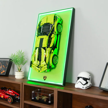 Yellow Lamborghini LEGO model mounted on green neon-lit wall display above wooden shelf with decor
