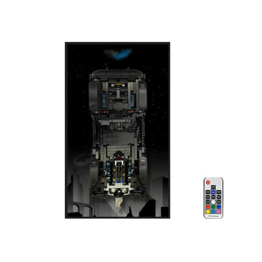 Black LEGO Batmobile model with jet thruster effect and remote control on starry Gotham City background