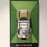 Top-down view of Lego Land Rover Defender model mounted on green and black framed display