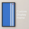 Black custom display frame with blue and white vertical stripes on beige wall with text Custom Display Frame